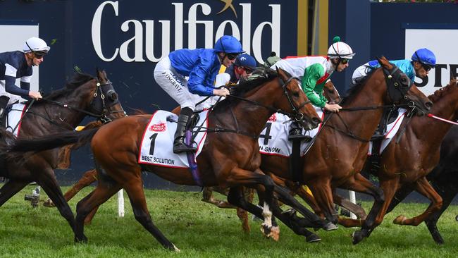 Pat Cosgrave and Best Solution creep forward from their wide gate as the field crawls down the home straight the first time.