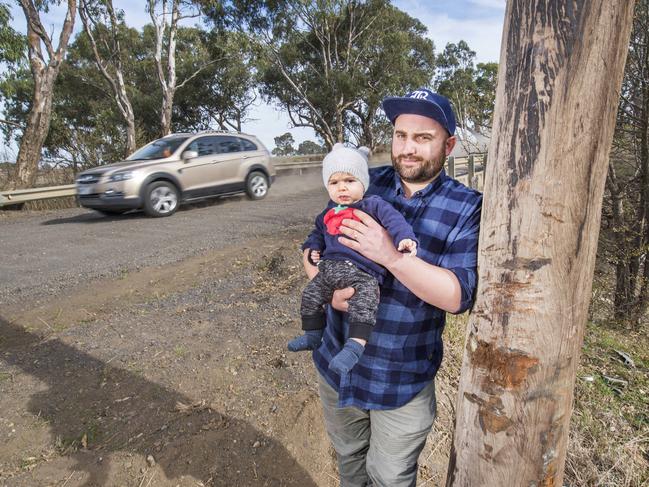 John and Ezra Dagher at the spot where a car crashed on Masons Rd.