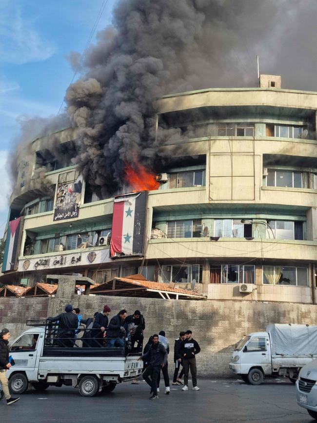 Flames sweep through the criminal security branch of Syria's Interior Ministry in Damascus. Picture: AFP