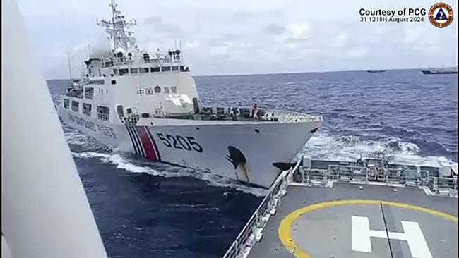 A Chinese coast Guard ship, left, is seen colliding with a Philippine Coast Guard ship, near the Sabina Shoal, in disputed waters of the South China Sea, on August 31 2024. Picture: AFP PHOTO / PHILIPPINE COAST GUARD