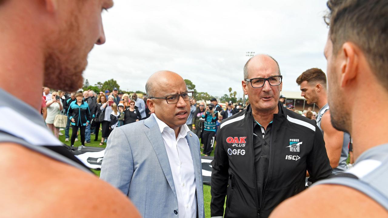 Port Adelaide David Koch and Sanjeev Gupta talking to players Travis Boak, Robbie Gray and Tom Jonas in 2019 when the sponsorship was announced. Picture: Tom Huntley