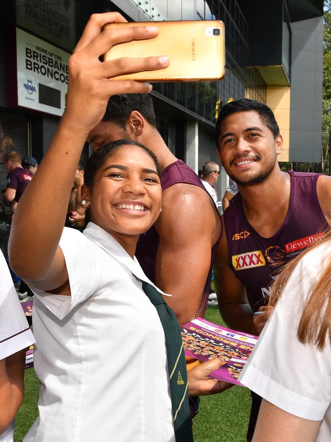 Anthony Milford takes a selfie with a student from the the Beyond The Broncos Girls Academy. Picture: AAP Image/Darren England