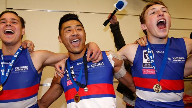 Dale, right, celebrates the Dogs’ 2016 VFL premiership with Lukas Webb and Lin Jong. Picture: AFL Media/Getty Images