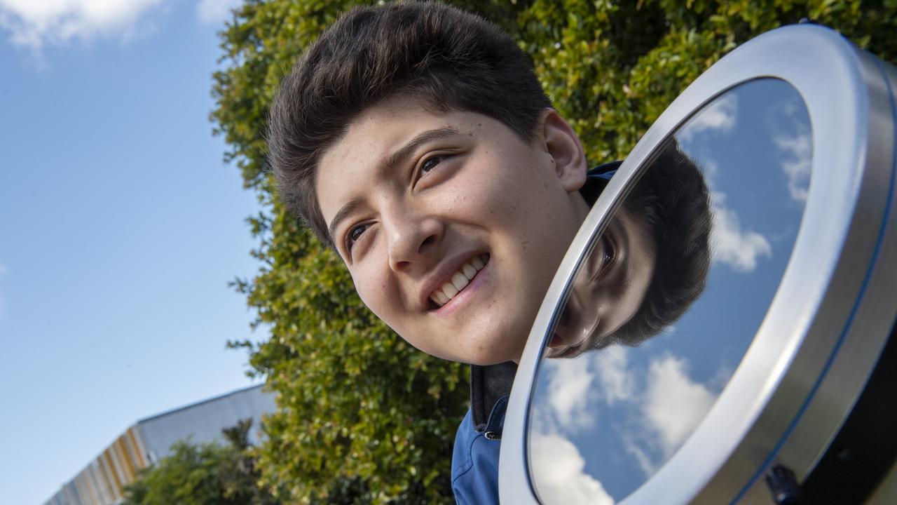 Connor Weinand, 17 investigates telescopes at the USQ open day. Sunday, August 15, 2021. Picture: Nev Madsen.