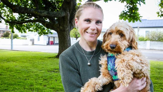 Rescued labradoodle Ted with his foster carer Ingrid Oliver of West Launceston. Picture: Patrick Gee