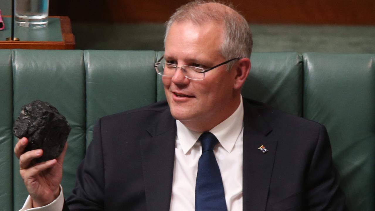 Treasurer Scott Morrison with a piece of coal during Question Time. Picture: Kym Smith