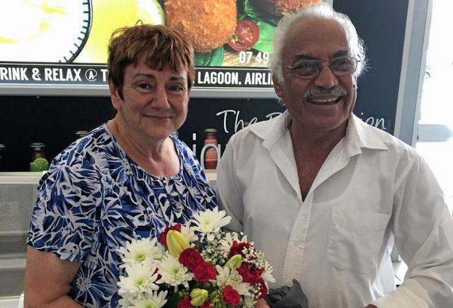 TOGETHER AT LAST: Helen Perikkentis and Miltiades Neothyton reunite at Whitsunday Coast Airport 60 years after he rescued Mrs Perikkentis from kidnappers in Cairo.