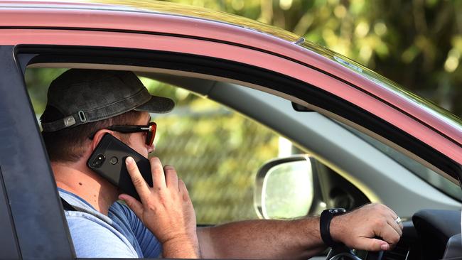 It’s illegal to use a mobile phone while driving, but not if it hasn’t got a SIM card. Picture: John Gass