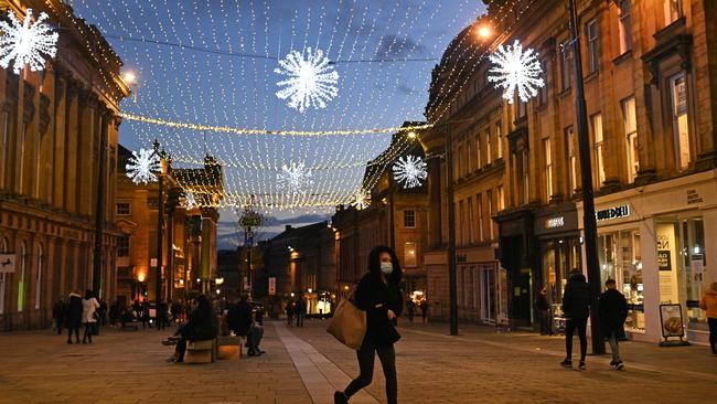 Pedestrians in central Newcastle-upon-Tyne, in north-east England on December 19. Picture: AFP