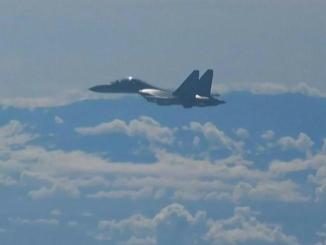 This screen grab made from video released by Chinese state broadcaster CCTV shows a Chinese military jet flying as part of military exercises near Taiwan on August 5, 2022. - Taiwan accused the Chinese army of simulating an attack on its main island on August 6, as Beijing doubled down on its retaliation for US House Speaker Nancy Pelosi's visit to Taipei after announcing a suspension of cooperation with Washington on key issues. (Photo by CCTV / AFP) / - China OUT - Macau OUT / Hong Kong OUT / RESTRICTED TO EDITORIAL USE - MANDATORY CREDIT "AFP PHOTO / CCTV" - NO MARKETING NO ADVERTISING CAMPAIGNS - NO RESALE - DISTRIBUTED AS A SERVICE TO CLIENTS - NO ARCHIVES