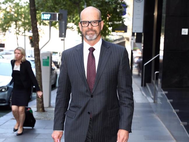 Former Victoria police commissioner Simon Overland leaves the Lawyer X royal commission. Picture: Aaron Francis