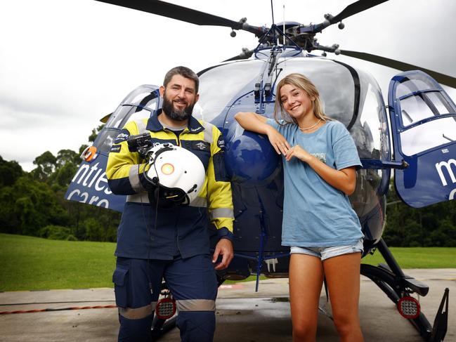 Reunited, Isabelle “Izzy” Hoffman and CareFlight helicopter pilot Travis West at Westmead in Sydney after the 15-year-old was injured in a freak boating accident. Picture: Richard Dobson