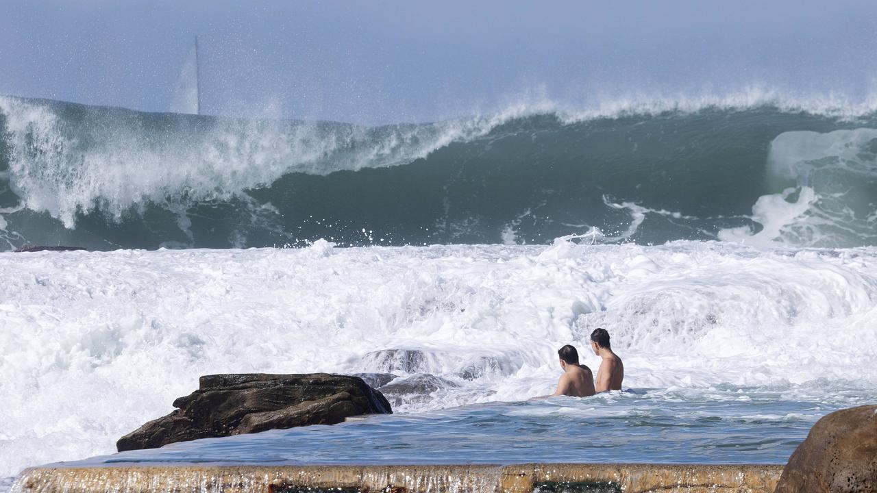 People continue to swim despite dangerous surf conditions at Whale Beach on April 19.