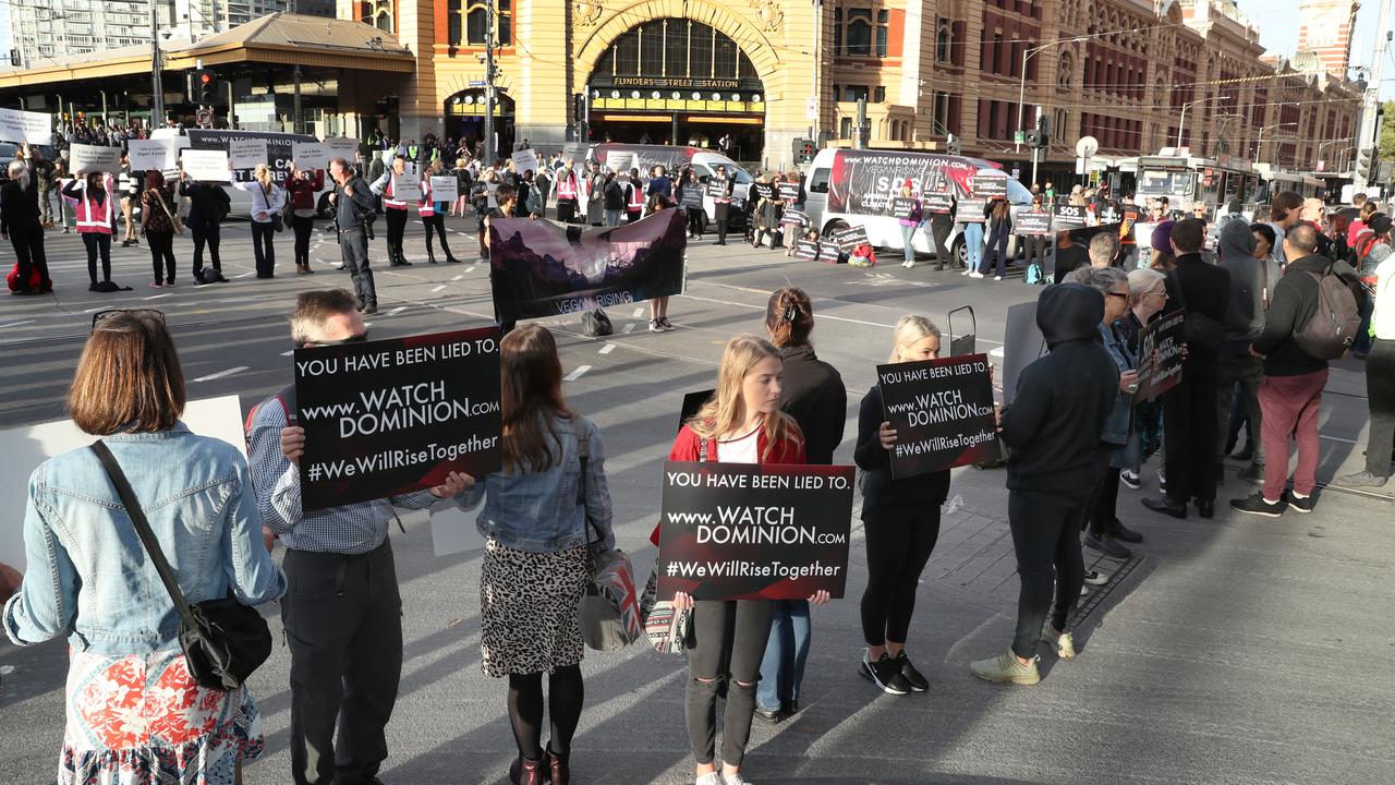 Animal rights protesters have formed a large circle in Melbourne’s CBD. Picture: AAP Image/David Crosling