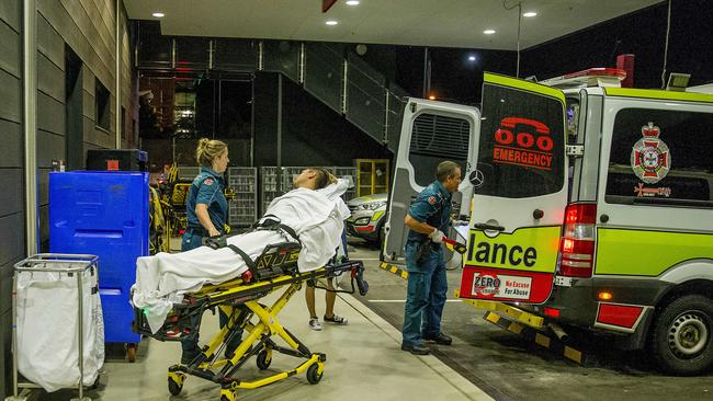 QAS handing patient to the Gold Coast University Hospital (GCUH).  Picture: Jerad Williams