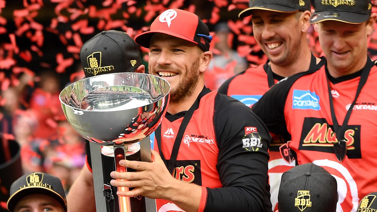 Melbourne Renegades captain Aaron Finch hoists last season’s Big Bash League trophy.