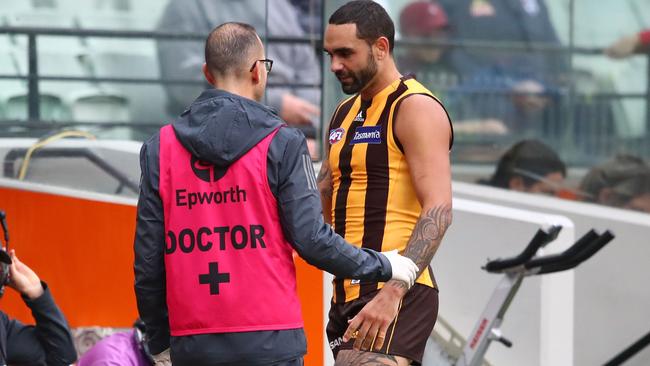 MELBOURNE, AUSTRALIA - MARCH 31: Shaun Burgoyne of the Hawks leaves the field injured during the round two AFL match between the Hawthorn hawks and the Western Bulldogs at Melbourne Cricket Ground on March 31, 2019 in Melbourne, Australia. (Photo by Scott Barbour/AFL Photos/Getty Images)
