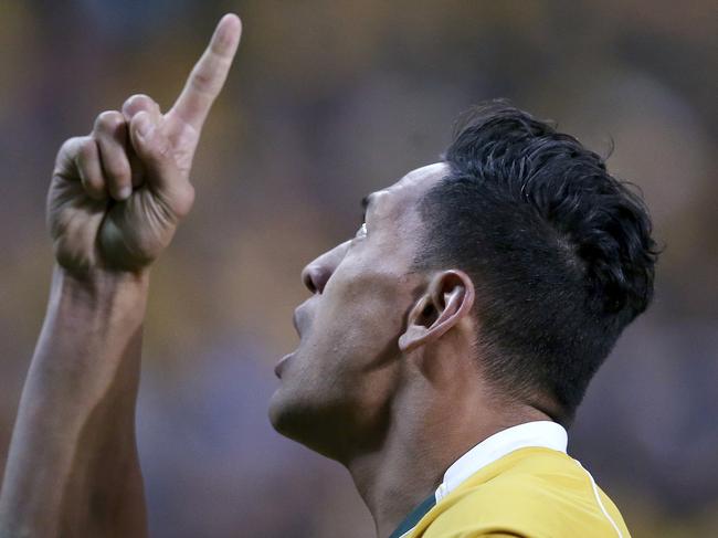 FILE - In this June 25, 2016, file photo, Australian rugby union player Israel Folau points to the sky after scoring a try against England during their rugby union test match in Sydney. The 30-year-old Folau will appear before a code of conduct hearing at Rugby Australia's headquarters in Sydney to determine the playing future of the star Wallabies fullback on Saturday, May 4, 2019. (AP Photo/Rick Rycroft, File)