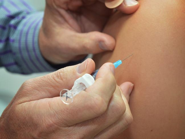 Channon Street, Medical Centre. Dr Rod Day giving a vaccination injection to 15 year old Brittany Marriott of Tin Can Bay who will be starting year 11 at Gympie State High School. Photo: Greg Miller / Gympie Times