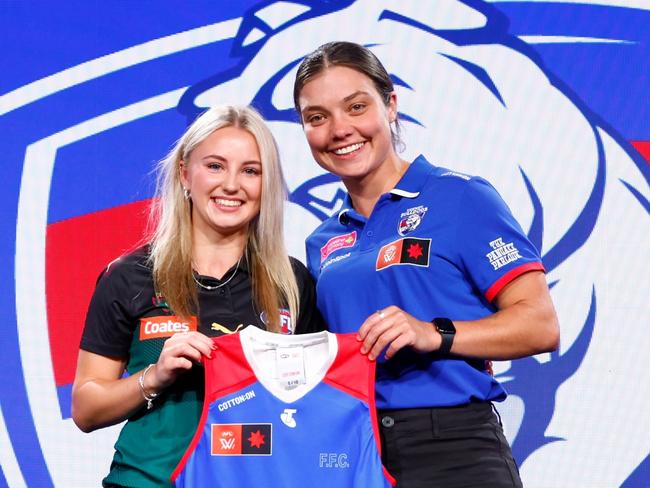 MELBOURNE, AUSTRALIA - DECEMBER 18: Number 4 pick Brooke Barwick is presented her jumper by Ellie Blackburn of the Bulldogs during the 2023 AFLW Draft at Marvel Stadium on December 18, 2023 in Melbourne, Australia. (Photo by Dylan Burns/AFL Photos via Getty Images)