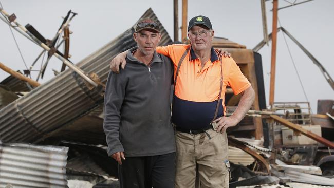 Third-generation Terang dairy farmers Phillip, 47, and his father Ian Grummett, 76, lost 57 cows. Picture: David Caird