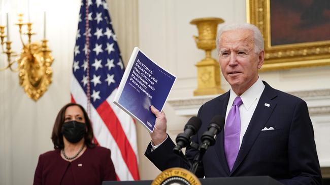 Joe Biden, flanked by Vice-President Kamala Harris, on Friday condemns Donald Trump for his lack of urgency in dealing with the pandemic. Picture: AFP