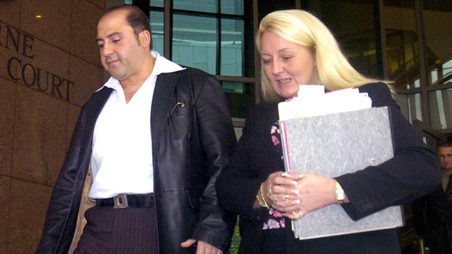 Tony Mokbel leaves Melbourne Magistrates Court in 2004 with Nicola Gobbo.