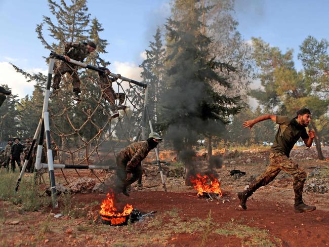 Members of the Hayat Tahrir al-Sham jihadist group at a training camp in Syria. Picture: Aaref WATAD / AFP