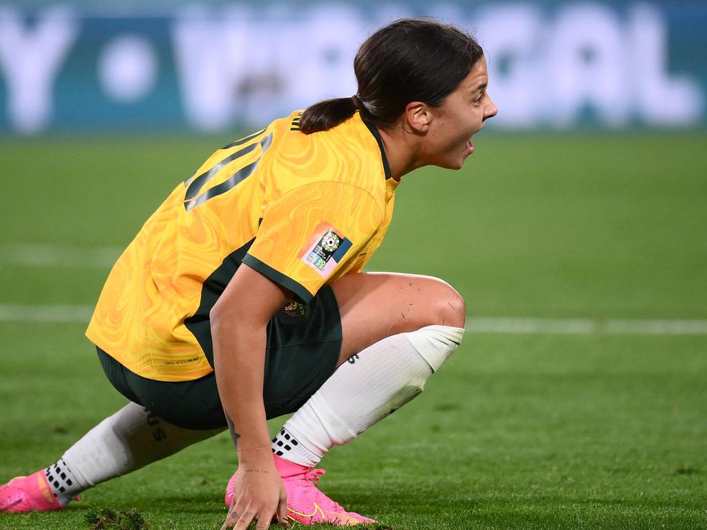 Sam Kerr winces in pain after going to ground. Picture: AFP