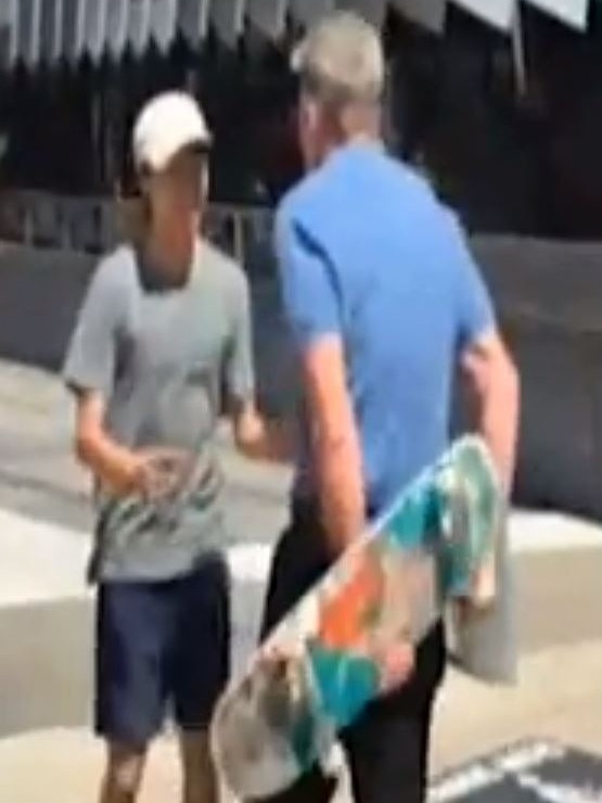 A screen grab from Seven News of Sam Newman during an altercation with a skater in Docklands.