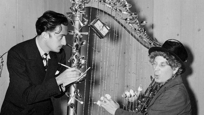 Artist Salvador Dali and comedian Harpo Marx with the barbed wire harp.