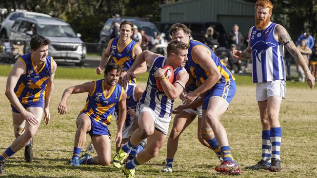 MPNFL: Langwarrin’s Zach Andrewartha escapes the pack. Picture: Valeriu Campan