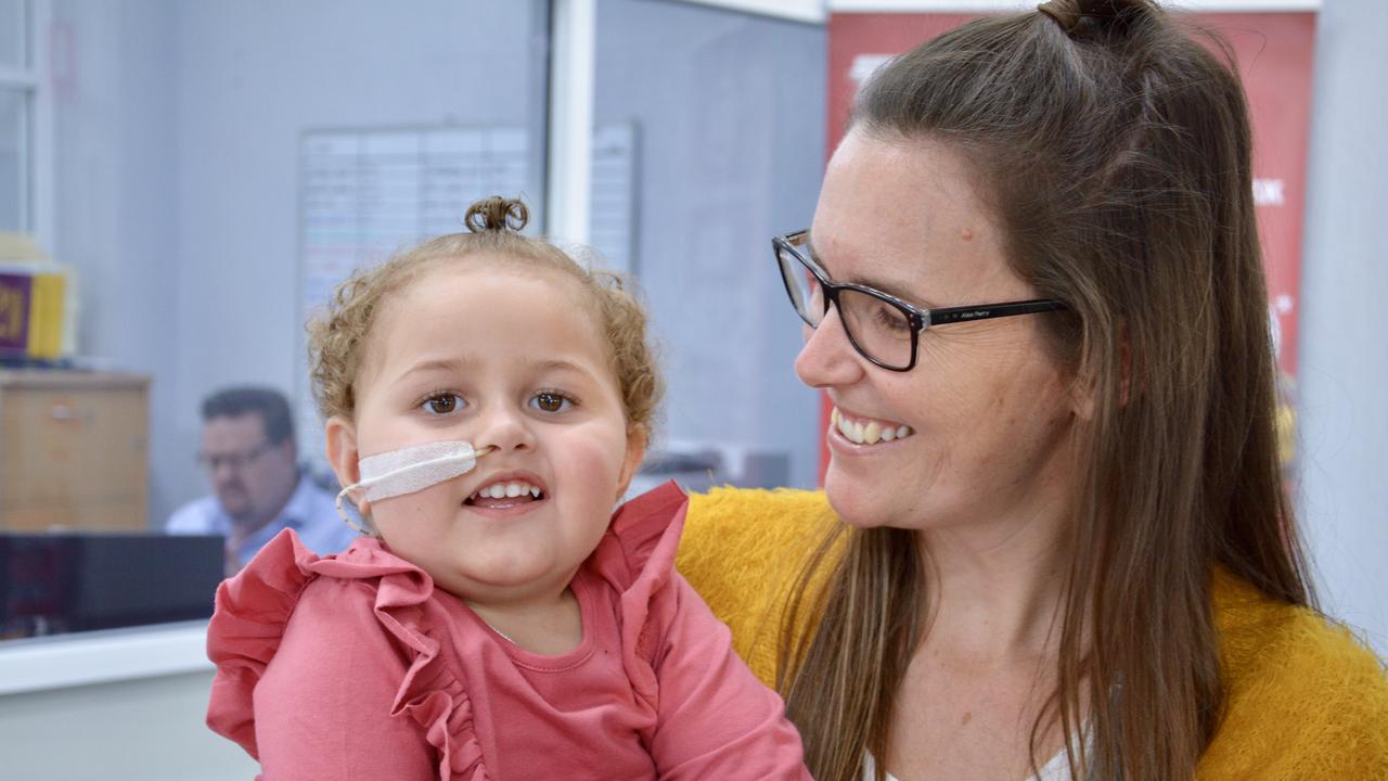 Moranbah's Maeri, 2, with her mum Jodi. Maeri was diagnosed at seven months with Wieacker-Wolff Syndrome which affects muscles and joints. Her family this week picked up a new Kia Carnival which they will convert for the wheelchair the toddler will soon need. Picture: Rae Wilson