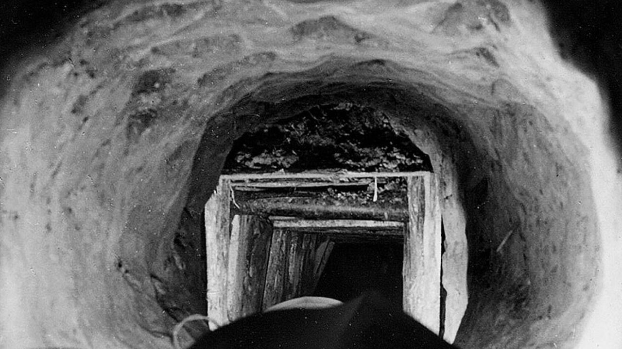 An image from the book 'Stalag Luft III: The German POW camp that inspired the Great Escape', that shows the narrow tunnel dug by the escaping prisoners.