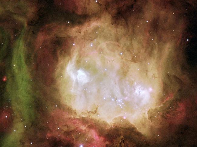 The 'Ghost Head Nebula' is one of a chain of star-forming regions lying south of the 30 Doradus nebula in the Large Magellanic cloud. 