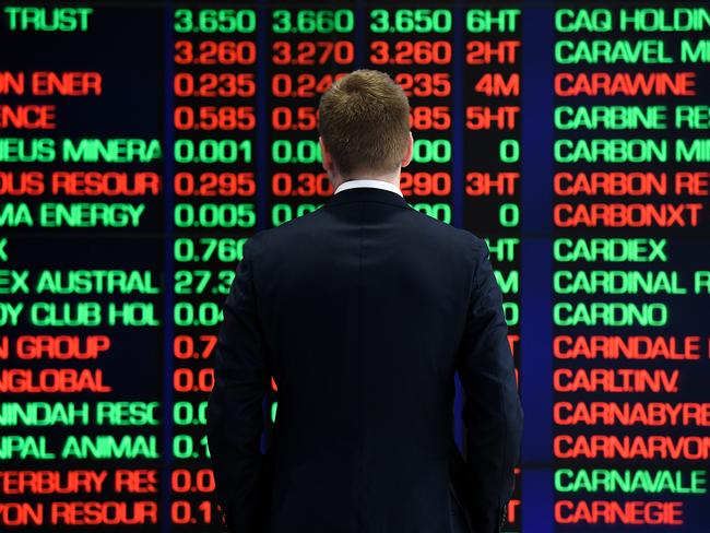 A man is seen looking at the digital market boards at the Australian Stock Exchange (ASX) in Sydney, Monday, March 9, 2020. The Australian share market has had its worst morning since the Global Financial Crisis in 2008, as the escalation of the coronavirus stifles international economic growth. (AAP Image/Bianca De Marchi) NO ARCHIVING