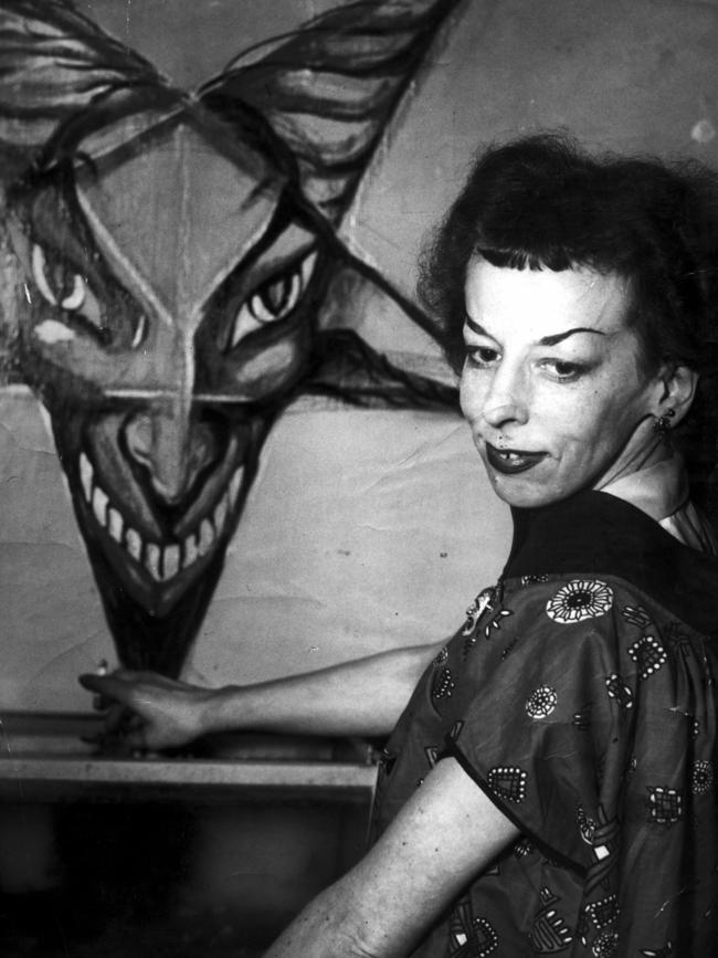 Rosaleen Norton with one of her artworks in Kings Cross, Sydney, in 1955. Picture: News Corp.