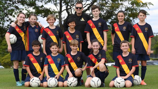 Western Pride technical director Mike Mulvey with enthusiastic students in the West Moreton Anglican College Football Excellence program. Picture: Rob Williams