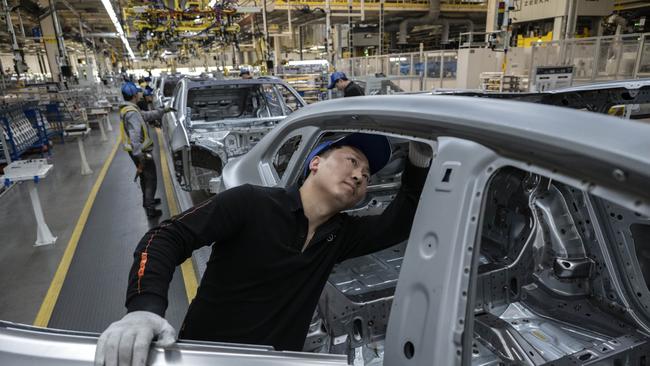 A worker checks a vehicle frame on the production line for electric vehicle maker Zeekr at its factory on May 29, 2025 in Ningbo, China. Picture: Kevin Frayer/Getty Images
