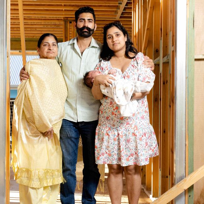 Porter Davis customers Sukhjit Kaur, Simerpal Singh and Taran Kaur with baby Nabab in their unfinished home. Picture: Richard Walker