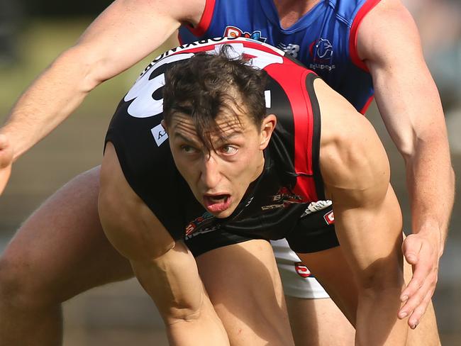 SANFL game between West Adelaide and Central District at Richmond Oval. WestÃs Patrick Levicki, cops a heavy tackle from CentralÃs Harry Grant. 1 May 2021. Picture Dean Martin