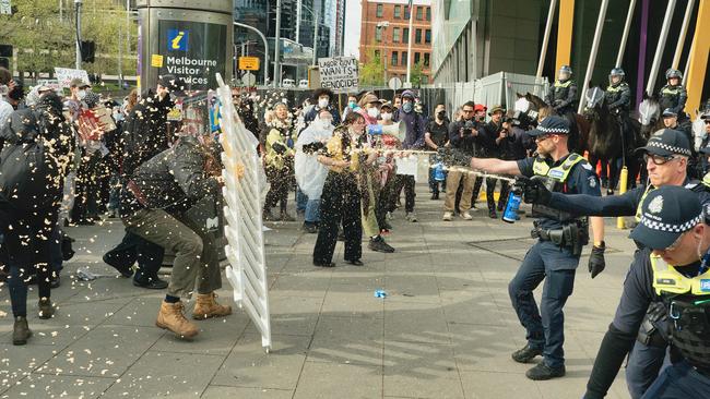 Protesters rally outside the Landforces event in Melbourne. Picture: NewsWire / Luis Enrique Ascui