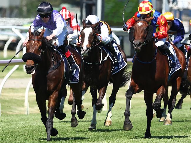 NEWCASTLE, AUSTRALIA - NOVEMBER 18: Zac Lloyd riding Stroke Of Luck wins Race 6 New Zealand Bloodstock The Beauford Handicap  during Sydney Racing ( The Hunter ) at Newcastle Racecourse on November 18, 2023 in Newcastle, Australia. (Photo by Jeremy Ng/Getty Images)