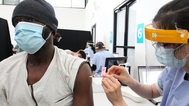 Registered Nurse Sarah administers a Covid-19 vaccine at the Lebanese Muslim Association (LMA) in Lakemba. Picture: Lisa Maree Williams/Getty Images