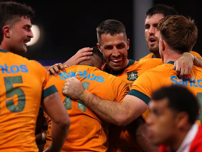 SYDNEY, AUSTRALIA - JULY 06: Filipo Daugunu of the Wallabies celebrates with team mates after scoring a try during the men's International Test match between Australia Wallabies and Wales at Allianz Stadium on July 06, 2024 in Sydney, Australia. (Photo by Jason McCawley/Getty Images)