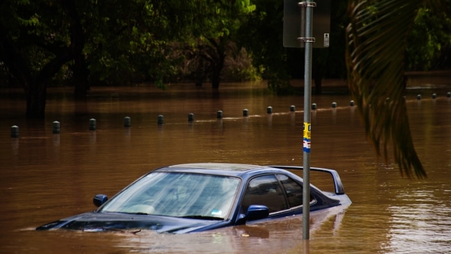 A car is submerged after Brisbane river banks burst at Kangaroo Point during a flood event. Picture: Getty Images