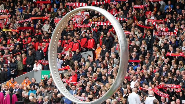 LIVERPOOL, ENGLAND - APRIL 15: Liverpool fans sing 'You'll Never Walk Alone' alongside the 'Eternal Ring' during a memorial service to mark the 27th anniversary of the Hillsborough disaster, at Anfield stadium on April 15, 2016 in Liverpool, England. Thousands of fans, friends and relatives took part in the final Anfield memorial service for the 96 victims of the Hillsborough disaster. Earlier this year relatives of the victims agreed that this year's service would be the last. Bells across the City of Liverpool rang out during a one minute silence in memory of the 96 Liverpool supporters who lost their lives during a crush at an FA Cup semi-final match against Nottingham Forest at the Hillsborough football ground in Sheffield, South Yorkshire in 1989. (Photo by Christopher Furlong/Getty Images)