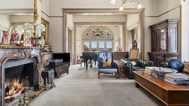 The interiors are a tapestry of grand period features, including ornate leadlight windows.