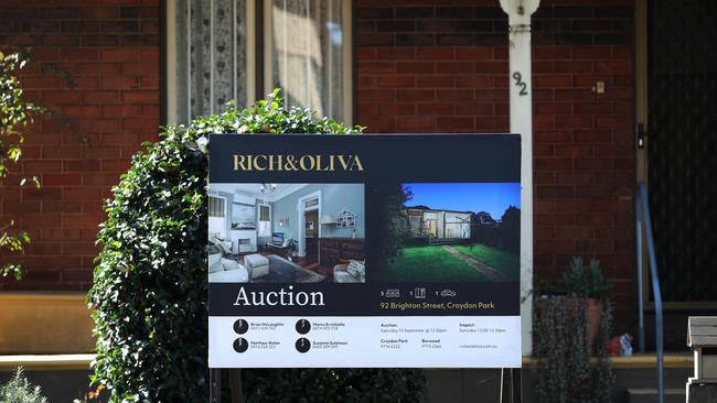 A real estate sign is seen at a property in Croydon Park on September 06, 2022 in Sydney, Australia. A rise in cost of living and increased mortgage rates are putting pressure on the Australian housing market, with prices predicted to continue to fall sharply over the coming year. (Photo by Lisa Maree Williams/Getty Images)