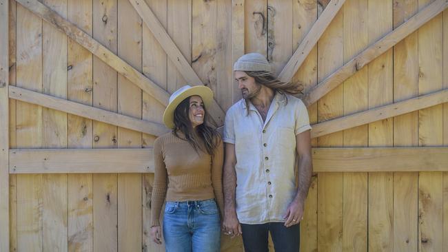 Lauren Williams and Alex Knorr travel around Australia in a Kombi selling hats and beanies. Picture: Roy Vandervegt